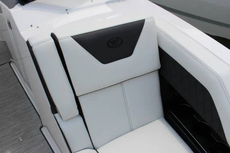 Slide: The Image of 2025 Cobalt R31 Surf boat interior with white cushioned seating and black accents. - 35