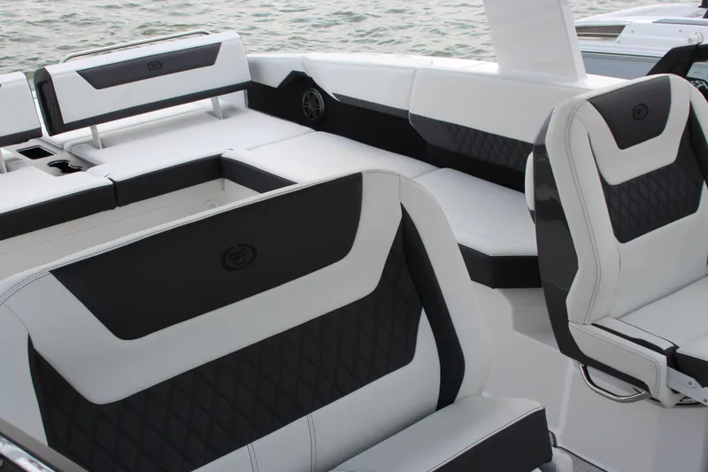 Slide: The Image of Luxury seating on 2025 Cobalt R31 Surf boat, featuring sleek black and white upholstery. - 37