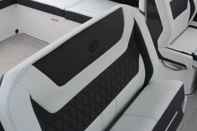 Slide: The Image of 2025 Cobalt R31 Surf boat interior with sleek black and white seating design. - 39