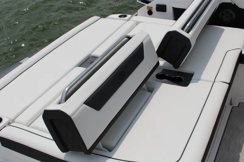 Slide: The Image of 2025 Cobalt R31 Surf boat with luxurious white seating and cup holders. - 40
