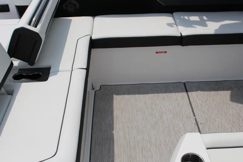 Slide: The Image of Interior seating of 2025 Cobalt R31 Surf boat with sleek white upholstery. - 5