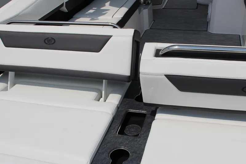 Slide: The Image of 2025 Cobalt R31 Surf boat interior with white and black seating, featuring sleek design elements. - 7