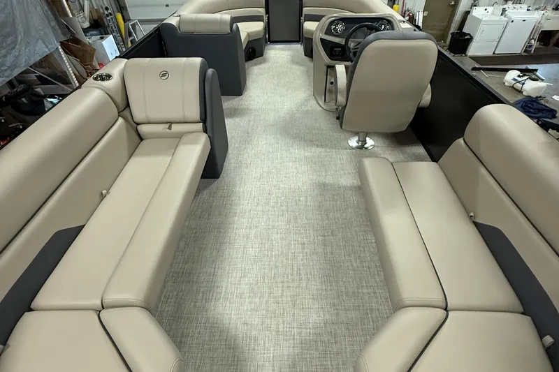Slide: The Image of Luxurious seating in 2025 Flagship F22CU boat, featuring beige and gray upholstery with cup holder. - 12