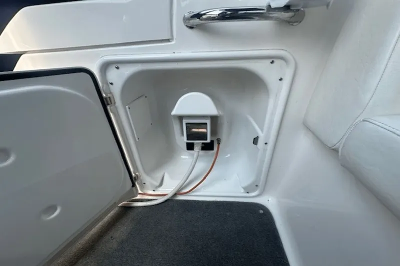Slide: The Image of Open compartment on 2008 Regal 2860 Window Express boat, showing interior wiring and components. - 12