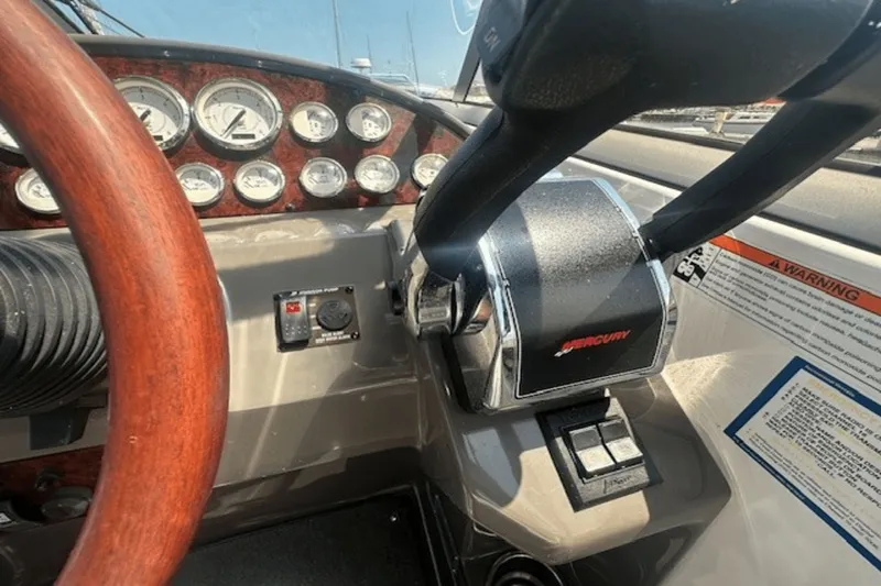 Slide: The Image of 2008 Regal 2860 Window Express dashboard with Mercury controls and gauges. - 18