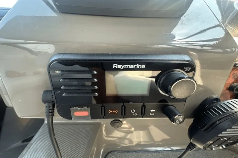 Slide: The Image of Raymarine marine radio on 2008 Regal 2860 Window Express dashboard. - 21