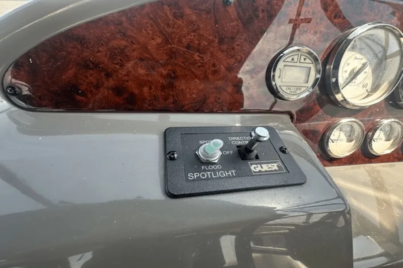 Slide: The Image of Control panel of a 2008 Regal 2860 Window Express boat with spotlight switch. - 22