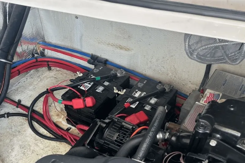 Slide: The Image of Engine compartment of a 2008 Regal 2860 Window Express with batteries and wiring. - 25