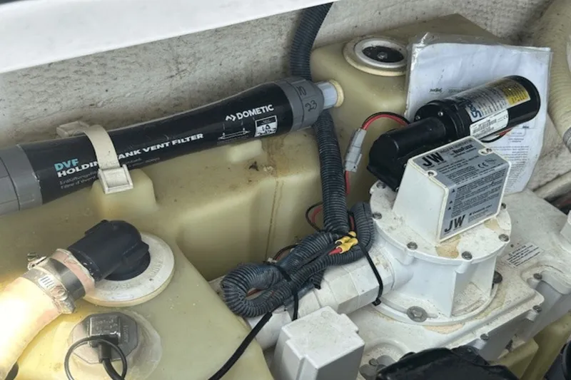 Slide: The Image of 2008 Regal 2860 Window Express boat engine compartment with Dometic tank vent filter. - 26