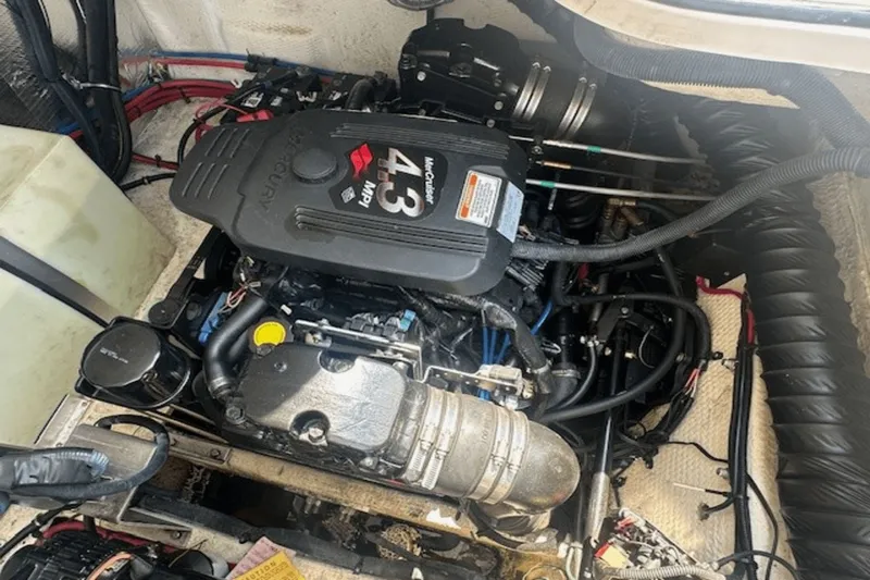 Slide: The Image of Engine compartment of a 2008 Regal 2860 Window Express boat, featuring a 4.3 MPI motor. - 28