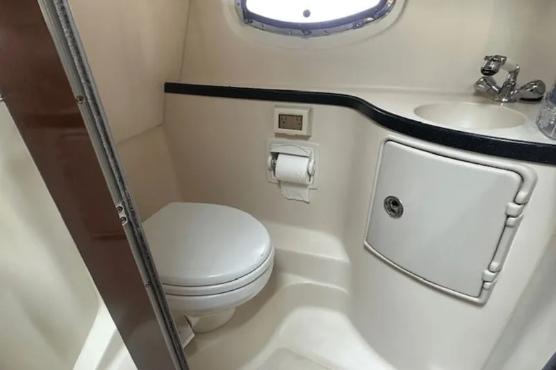 Slide: The Image of 2008 Regal 2860 Window Express boat bathroom interior with toilet and sink. - 35
