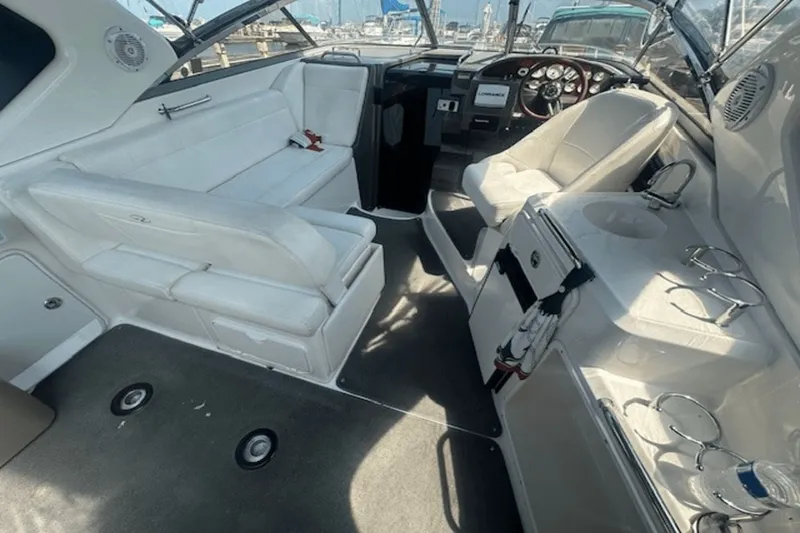 Slide: The Image of 2008 Regal 2860 Window Express boat interior with white seating and helm. - 6