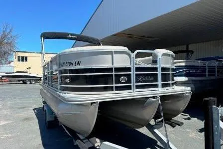 Slide: The Image of 2017 Berkshire 22CL CTS pontoon boat parked under a shelter. - 1