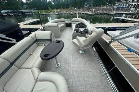 Slide: The Image of 2017 Berkshire 22CL CTS pontoon boat with spacious seating and sleek design at a dock. - 11