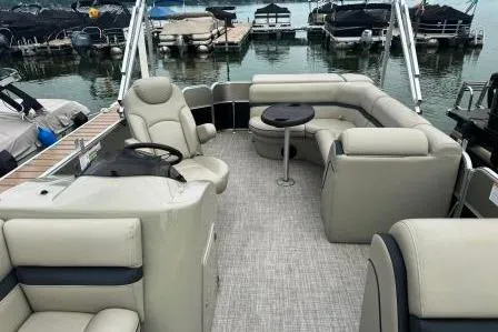 Slide: The Image of 2017 Berkshire 22CL CTS pontoon boat with spacious seating at a marina. - 15
