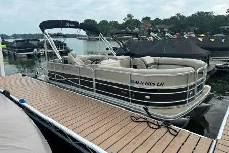 Slide: The Image of 2017 Berkshire 22CL CTS pontoon boat docked on a calm lake. - 16