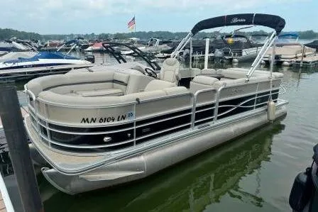 Slide: The Image of 2017 Berkshire 22CL CTS pontoon boat docked at marina with American flag in background. - 19