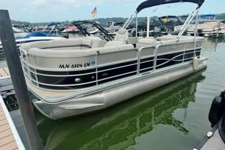 Slide: The Image of 2017 Berkshire 22CL CTS pontoon boat docked on a lake with other boats. - 5