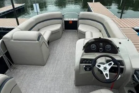 Slide: The Image of 2017 Berkshire 22CL CTS pontoon boat interior with plush seating and modern dashboard. - 6