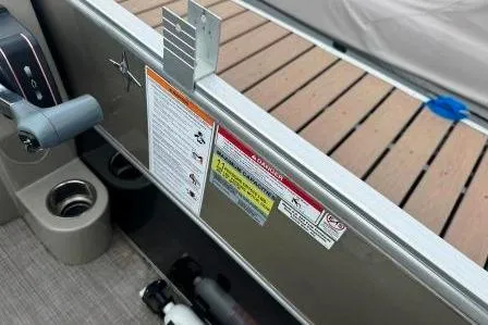 Slide: The Image of 2017 Berkshire 22CL CTS boat interior with control panel and safety labels. - 8