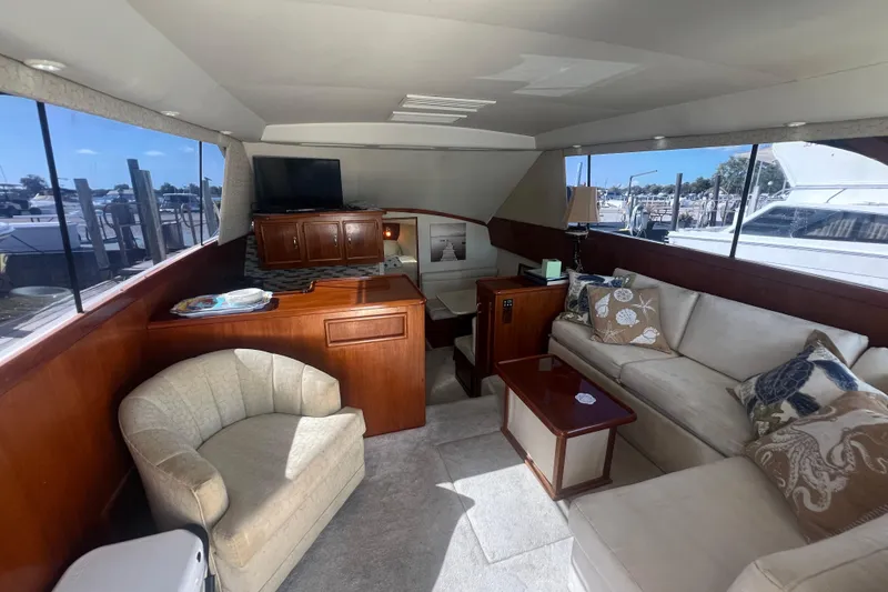 Slide: The Image of Luxurious interior of 1990 Ocean Yachts 35 Sport Sedan with plush seating and elegant decor. - 11