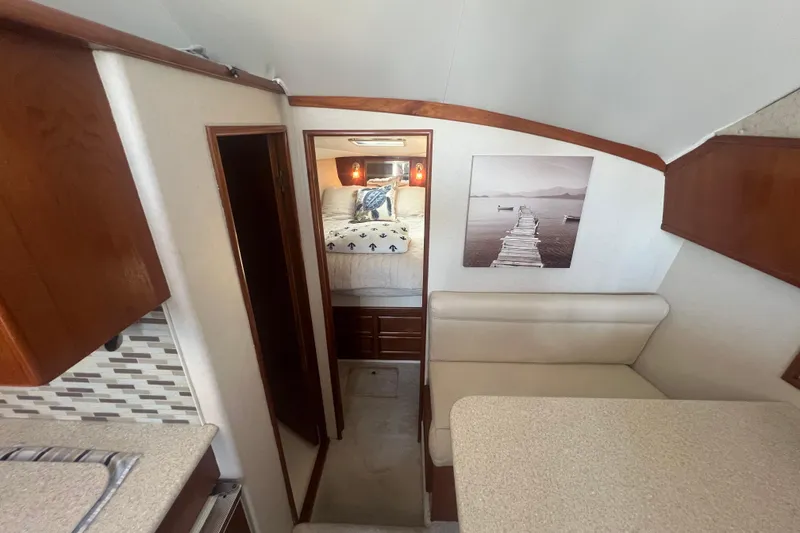 Slide: The Image of Interior of 1990 Ocean Yachts 35 Sport Sedan with cozy cabin and modern decor. - 17
