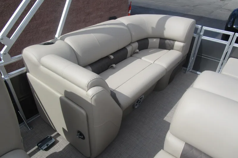 Slide: The Image of 2025 Sun Tracker PB 22 RF pontoon boat with beige seating and modern design. - 16