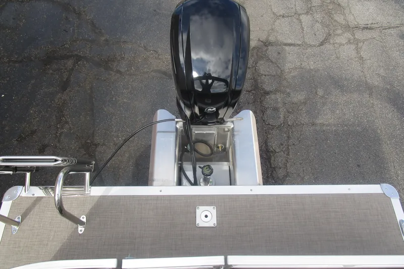 Slide: The Image of 2025 Sun Tracker PB 22 RF pontoon boat with outboard motor, viewed from above. - 17