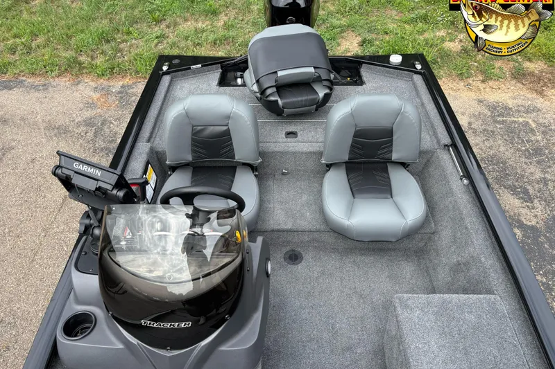 Slide: The Image of 2023 Tracker Pro 170 boat interior with Garmin system and gray seating. - 8