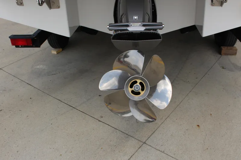 Slide: The Image of 2025 Cobalt CS23 boat propeller on concrete surface, showcasing sleek design. - 14