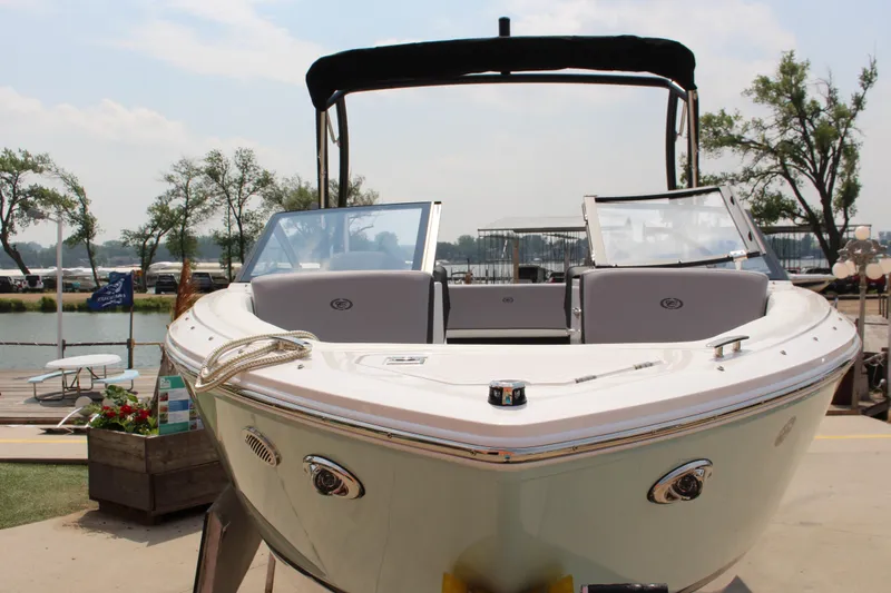 Slide: The Image of 2025 Cobalt CS23 boat docked, featuring sleek design and modern amenities. - 20