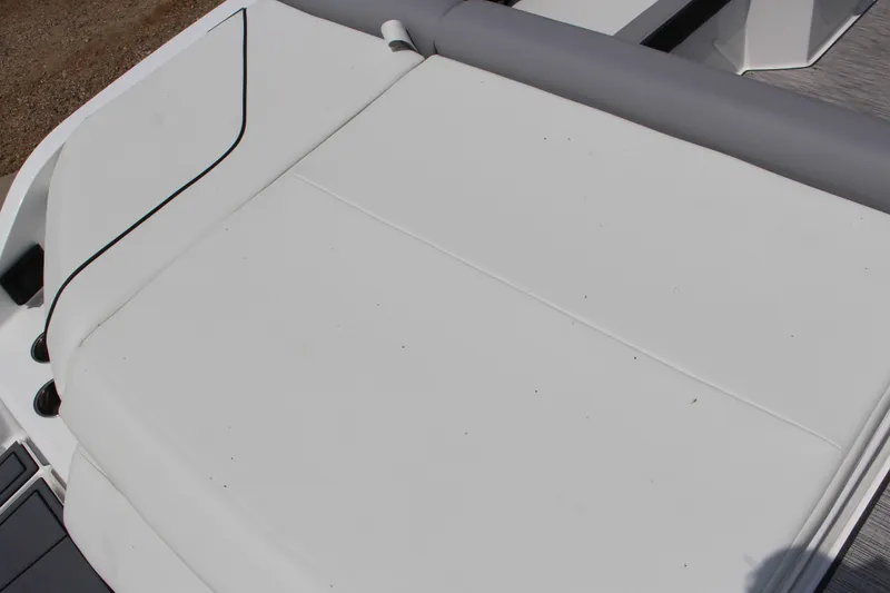 Slide: The Image of 2025 Cobalt CS23 boat with sleek white seating and modern design. - 21