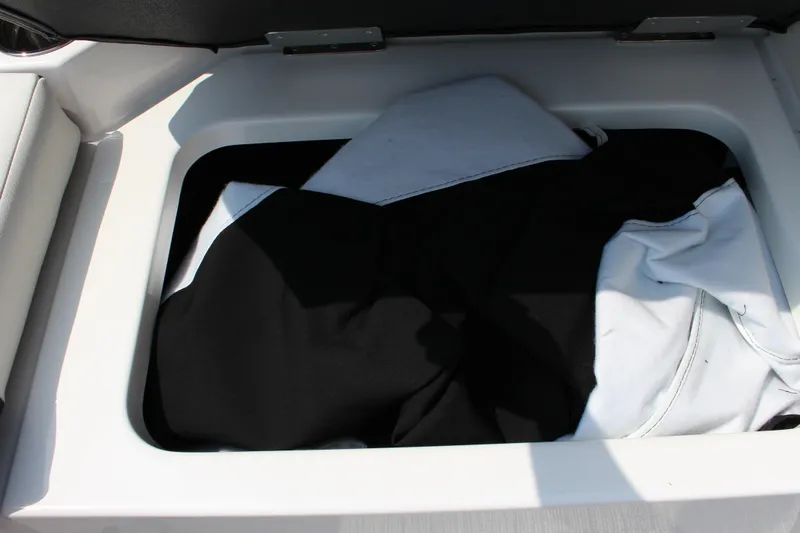 Slide: The Image of 2025 Cobalt CS23 storage compartment with black and white fabric inside. - 28
