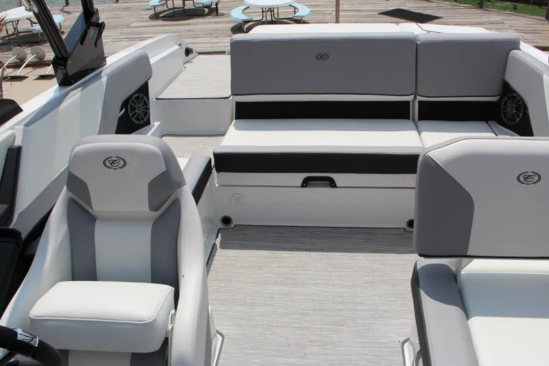 Slide: The Image of 2025 Cobalt CS23 boat interior with sleek gray and white seating design. - 31