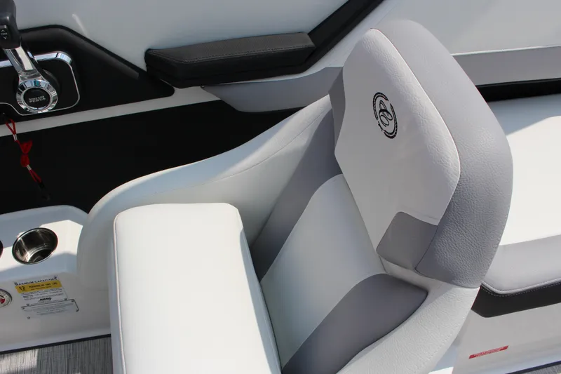 Slide: The Image of 2025 Cobalt CS23 boat interior with sleek white and gray seating design. - 34