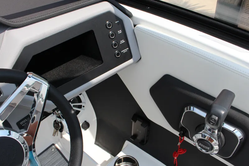 Slide: The Image of 2025 Cobalt CS23 boat dashboard with steering wheel and control panel. - 35