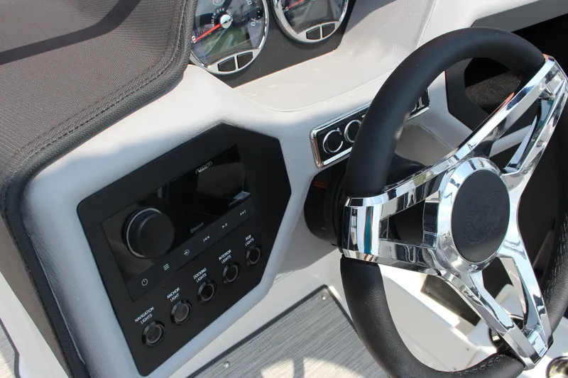 Slide: The Image of 2025 Cobalt CS23 boat dashboard with chrome steering wheel and control panel. - 36