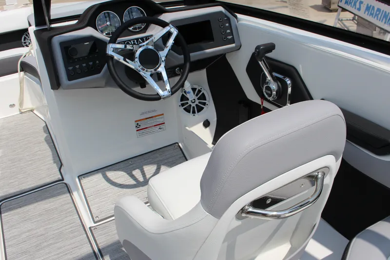 Slide: The Image of 2025 Cobalt CS23 boat cockpit with steering wheel and control panel. - 4