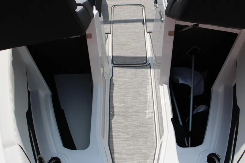Slide: The Image of 2025 Cobalt CS23 boat interior with storage compartments and seating. - 40