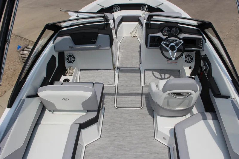 Slide: The Image of 2025 Cobalt CS23 boat interior with modern dashboard and seating. - 47