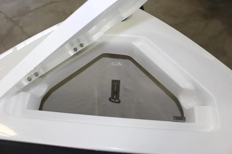 Slide: The Image of Open storage compartment on 2025 Cobalt CS23 Surf boat, showcasing interior design. - 10