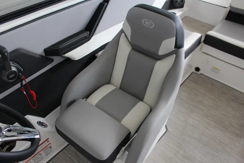 Slide: The Image of 2025 Cobalt CS23 Surf boat interior with gray and white captain's seat. - 13