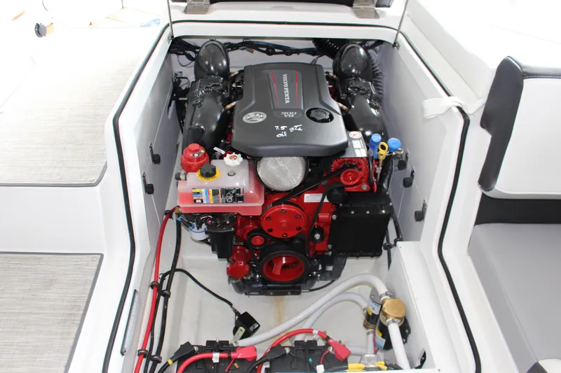 Slide: The Image of 2025 Cobalt CS23 Surf boat engine compartment, showcasing a powerful inboard motor. - 18