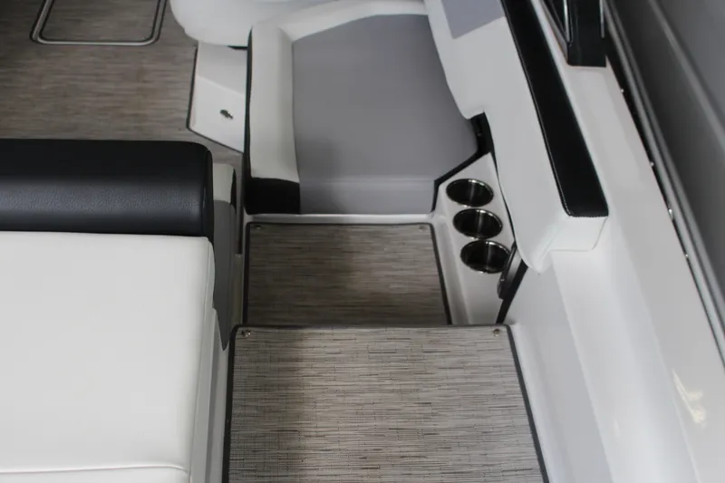 Slide: The Image of 2025 Cobalt CS23 Surf boat interior with seating and cup holders. - 4