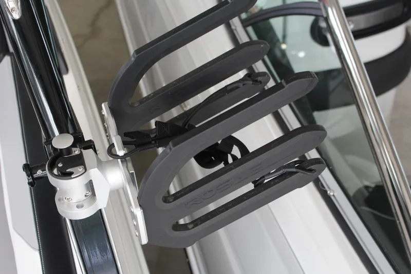 Slide: The Image of 2025 Cobalt CS23 Surf boat with a sleek wakeboard rack attachment. - 5