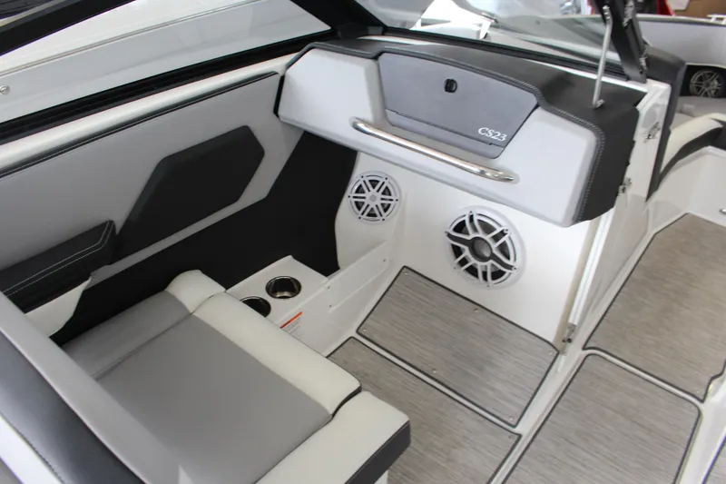 Slide: The Image of 2025 Cobalt CS23 Surf boat interior with seating, speakers, and modern design elements. - 7