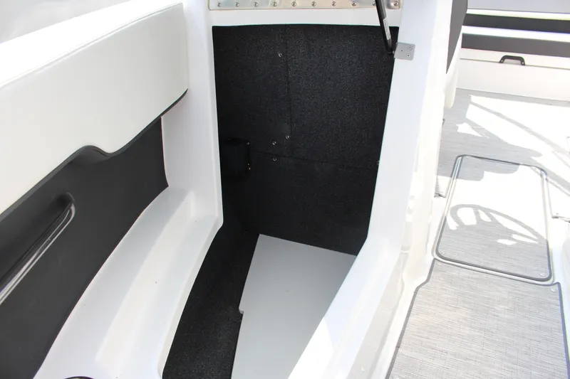 Slide: The Image of 2025 Cobalt CS23 boat interior with sleek white and black design elements. - 11