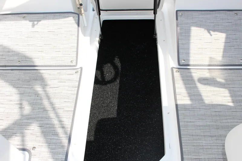Slide: The Image of 2025 Cobalt CS23 boat interior with textured flooring and sleek design. - 13