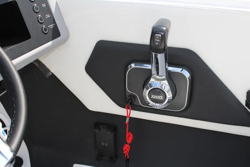Slide: The Image of 2025 Cobalt CS23 boat throttle control with Volvo Penta branding and trim adjustment. - 15
