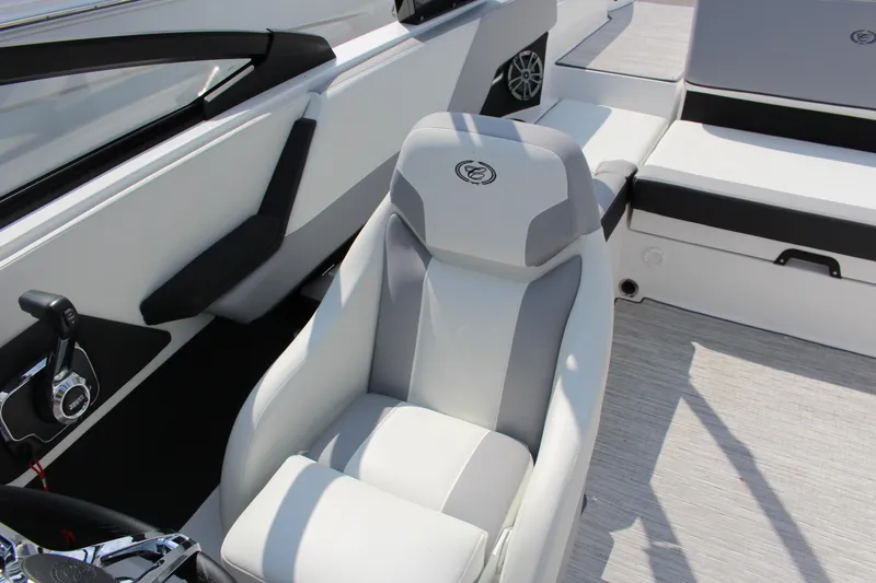 Slide: The Image of 2025 Cobalt CS23 boat interior with sleek white and gray seating and modern controls. - 17